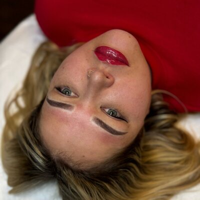 Full face of fresh permanent makeup — bold lip blush, defined brows and subtle eyeliner, photographed just after the appointment.